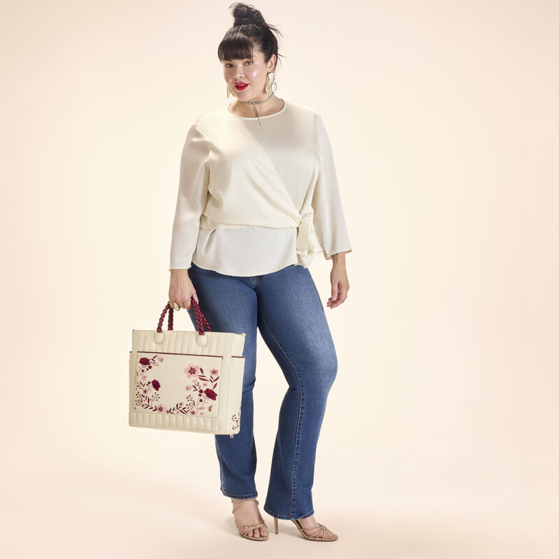 Loungefly Cream & Red Floral Convertible Backpack and Tote Crossbody Bag LFlifestyle1 view 2